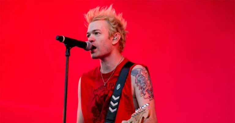 Sum 41 singer deryck whibley in hospital with pneumonia wife ariana cooper shares ambulance pic regrets missing chicago.